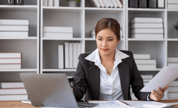 A translator checks a side by side document for accuracy, delivering Translation Services in Urbandale with reliable results.