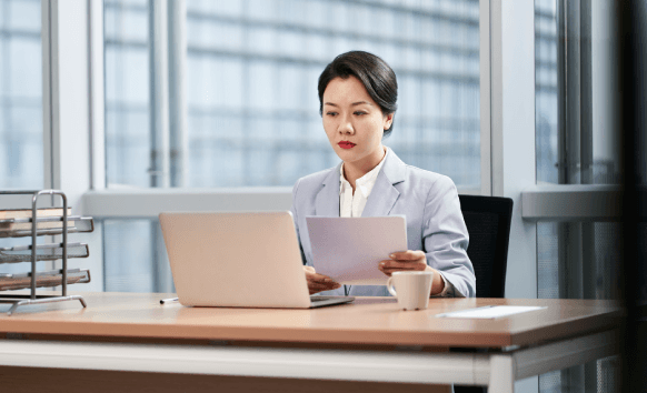 A translator providing a certified packet during Translation Services in Ankeny, preparing documents for official submission.