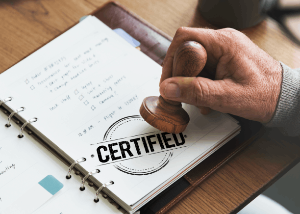 A notary verifies an apostille stamp beside certified translations, highlighting Translation Services in Des Moines.