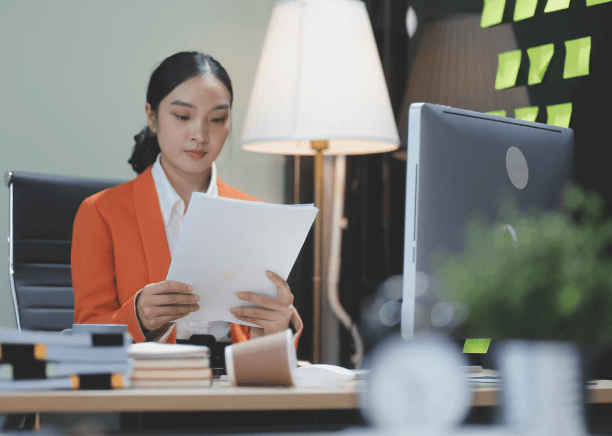 At an Iowa office, staff review a Vietnamese contract as Vietnamese Translation Services support business negotiations.