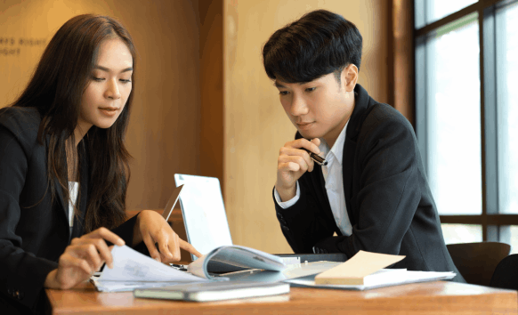An ATA-certified linguist providing a certified packet, explaining Chinese Translation Services in Iowa to a client.