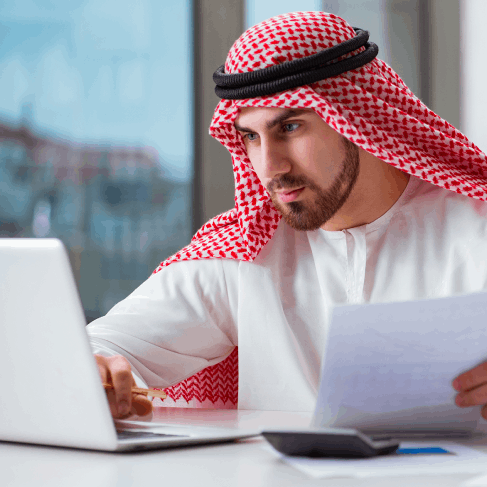 A paralegal reviews a court filing as Arabic Translation Services in Iowa prepare a legal document translation for trial.