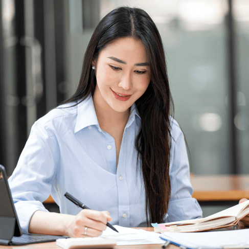 A customer reviews contracts as Vietnamese Translation Services deliver a legal translation packet for an Iowa case.