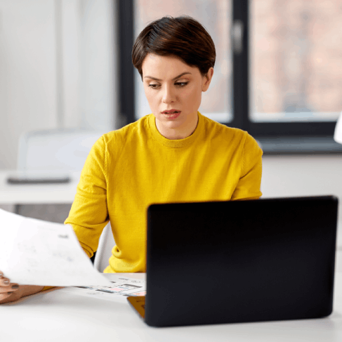 A client receives a certified translated affidavit across a desk, reflecting legal Translation Services in Des Moines.