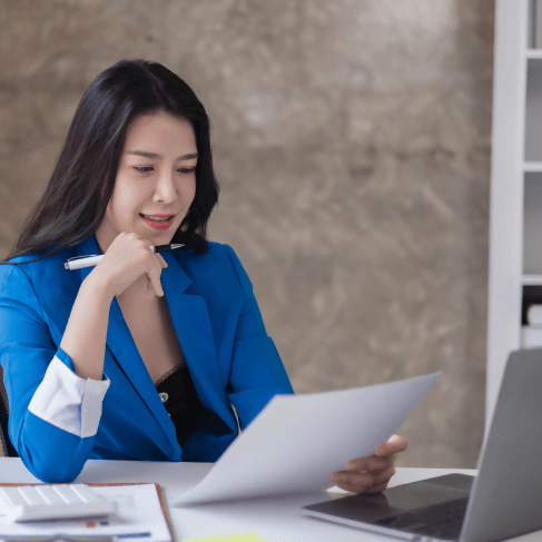 An expert translator review a bilingual contract, showing Translation Services in Urbandale for accurate legal.