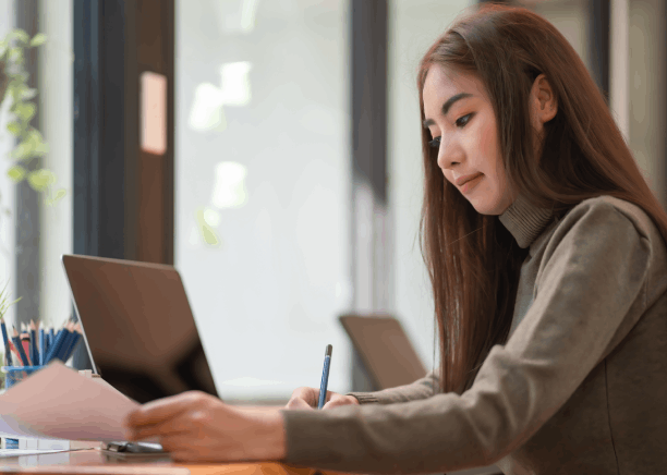 A translator signs a certification page as Chinese Translation Services in Iowa deliver Simplified Chinese USCIS documents.
