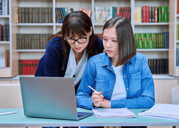 A student meets a native Spanish translator on campus to discuss academic document needs through Spanish Translation.