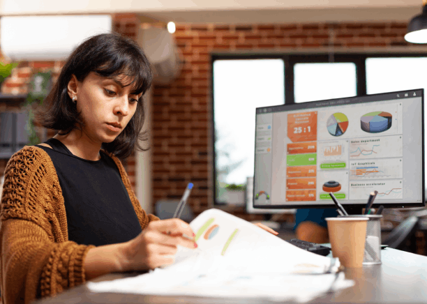 A linguist checks diagrams and labels in a user guide, highlighting Translation Services in West Des Moines for technical.