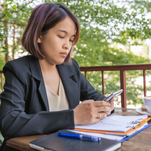 A client checks a certified USCIS translation in Iowa as Vietnamese Translation Services finalize immigration documents.